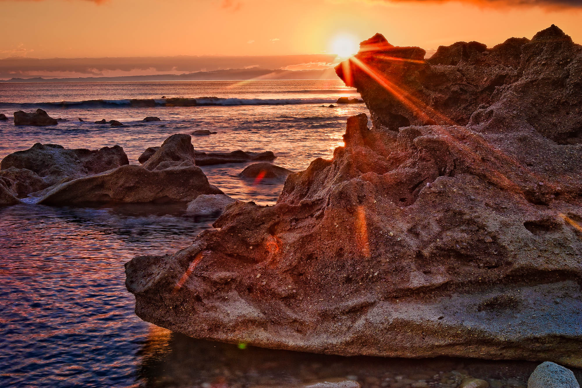 Rock in front of the sun